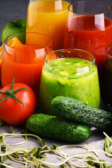 Glasses with fresh organic vegetable and fruit juices