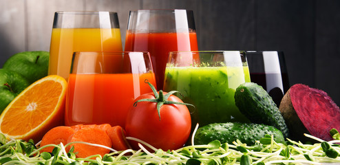 Glasses with fresh organic vegetable and fruit juices