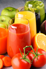 Glasses with fresh organic vegetable and fruit juices