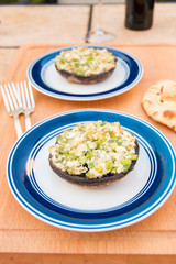 Grilled stuffed portobello mushrooms with feta cheese and scallions.