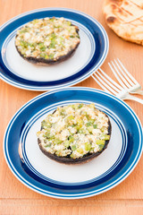 Grilled stuffed portobello mushrooms with feta cheese and scallions.