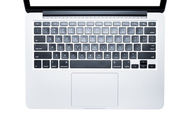 Top view, Male's hand working by using and typing on white laptop with blank white screen. Isolated on white background with clipping path.