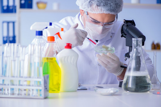 Man in the lab testing new cleaning solution detergent