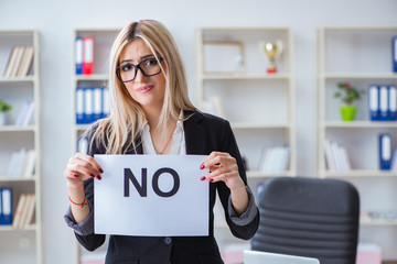 Young businesswoman with message in the office