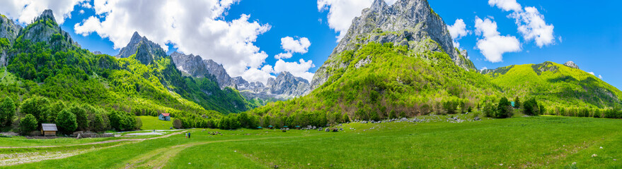 Fototapeta na wymiar Spacious picturesque meadows among the huge mountains.