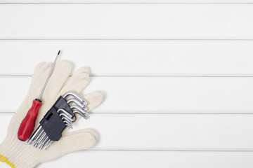 Tools on a white wooden background
