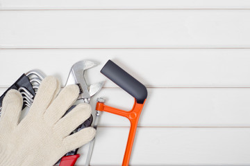 Tools on a white wooden background