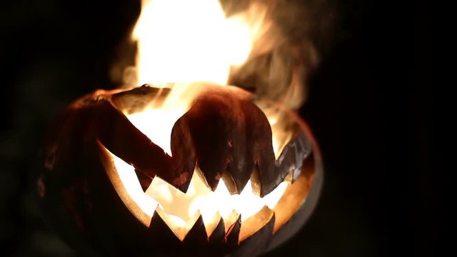 Burning pumpkin on Halloween. Looped