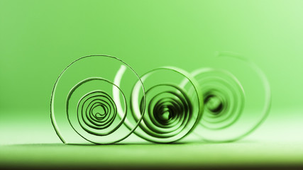 Macro, abstract, background picture of green paper spirals on paper background
