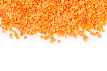 Texture of red lentils isolated on white background.