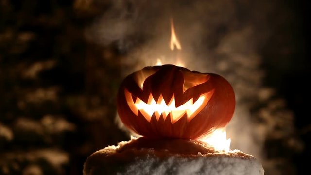 Burning pumpkin on Halloween. Looped