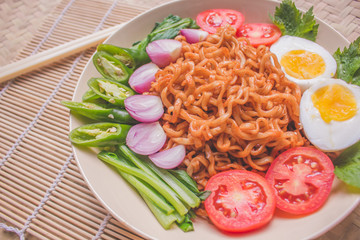 Delicious Fried Noodles on Unique Bamboo Woven Table 