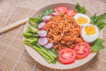 Delicious Fried Noodles on Unique Bamboo Woven Table 