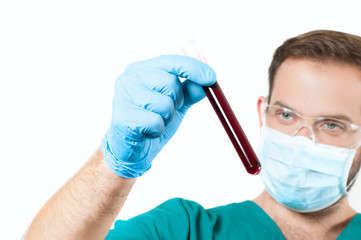 Doctor hand in glove holding test tube with sample blood