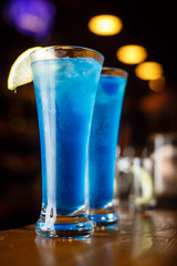 Two cocktails of blue lagoon at the bar