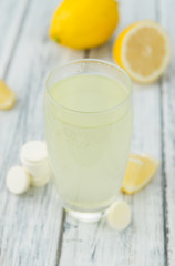 Vitamin C Tablets on wooden background; selective focus