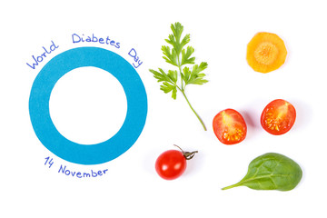 Blue circle of paper as symbol of world diabetes day and fresh vegetables, healthy nutrition during disease