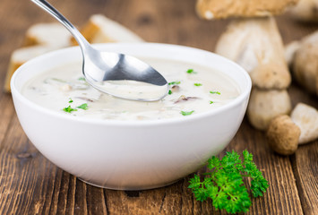 Porcini Soup on vintage wooden background