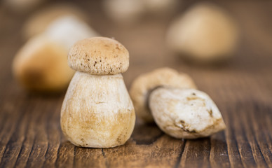 Fresh Porcinis (raw) on a vintage background (close-up shot)