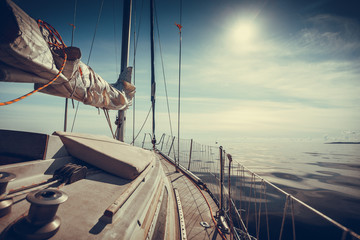 Yachting on sail boat during sunny weather