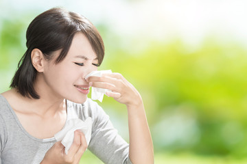 woman blowing nose