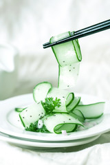 Close up cucumber salad and with the chia seeds and green parsley leaf , heathy salad for anti aging with rich of antioxidant organic food concept