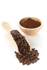 Coffee beans with ground coffee in wooden bowl