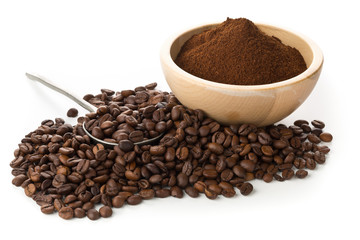 Coffee beans with ground coffee in wooden bowl