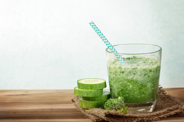 close up a green sliced cucumber with mixed green vegetable and green juice  for healthy organic green food concept
