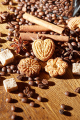 Aroma coffee chocolate cookies and spices on the wooden table. Dark wooden background. Top view. Close. Closeup.