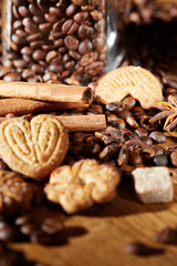 Aroma coffee chocolate cookies and spices on the wooden table. Dark wooden background. Top view. Close. Closeup.