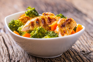 Chicken and vegetable salad. Pieces of grilled chicken with carrots and broccoli