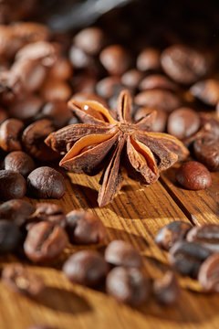 Aroma coffee chocolate cookies and spices on the wooden table. Dark wooden background. Top view. Close. Closeup. © Olef