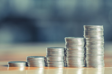 Stacks of coins on working table, finance and business concept, shallow focus.