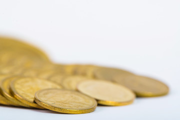 Columns of gold coins, piles of coins on white background