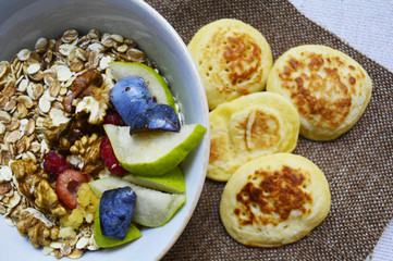 porridge with fruit , berries and pancakes for Breakfast, healthy eating