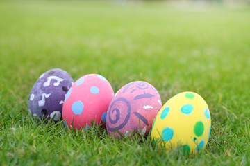Eggs painted pastel line in the grass backgroud.
