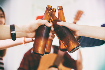 Asian group of friends having party with alcoholic beer drinks and Young people enjoying at a bar...