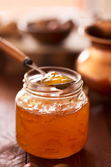 Peach jam in a transparent jar