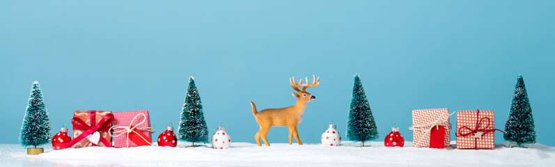 Christmas holiday theme with reindeer and Christmas trees © Tierney