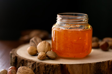 Peach jam in a transparent jar