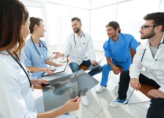 Fototapeta premium medical staff discussing x-ray of a patient