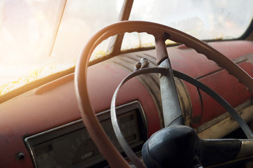 Classic car interior and old steering wheel