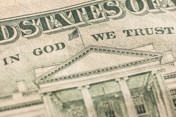 The inscription "In God We Trust" on a twenty dollar bill of the USA. Macro.