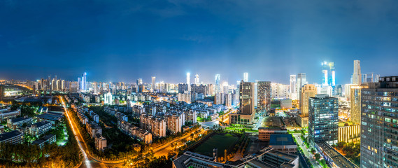 Fototapeta premium Bird view at Nanchang China. Skyscraper under construction in foreground. Fog, overcast sky and pollution. Bund (Nanchang) area