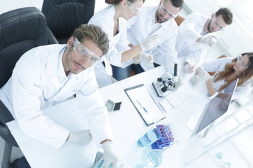 view from the top.modern young scientist sitting at workplace