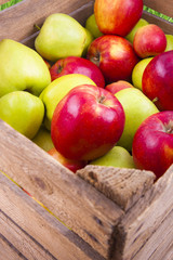 Fresh apples in wooden box