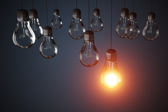 Many light bulbs and one is glowing. 3D rendered illustration.