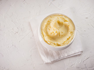 Mashed potatoes on white concrete background
