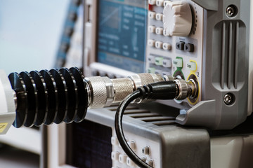 Measuring high-frequency equipment. Special high-frequency connectors are inserted into the instrument panel.